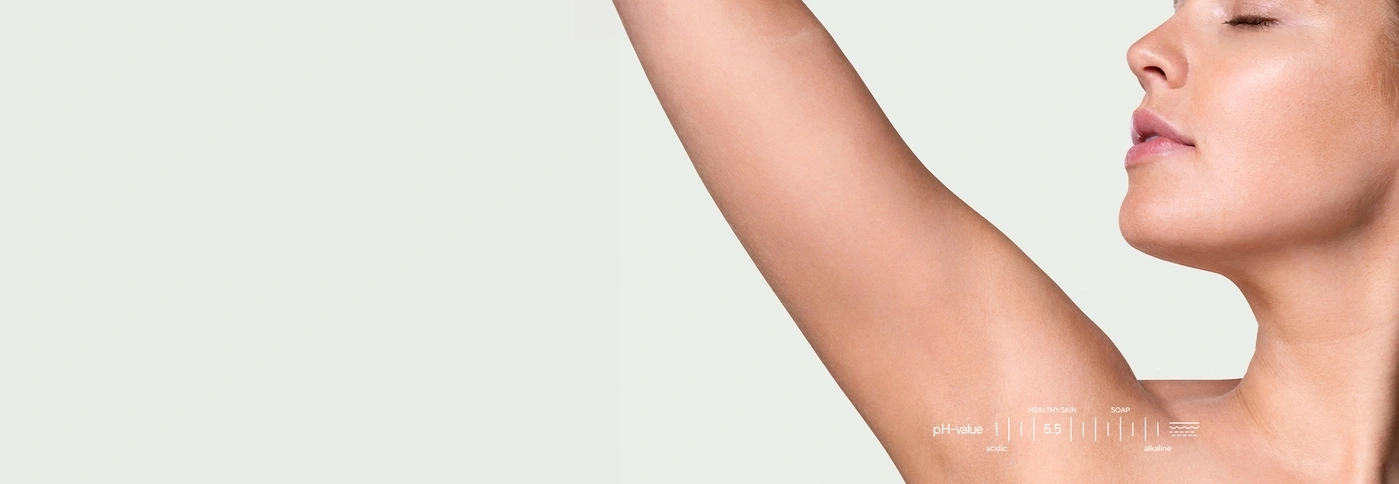 A woman with a pH value chart on her arm.