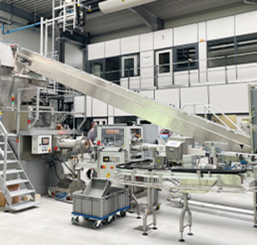 Industrial packaging line with conveyor and production line in factory