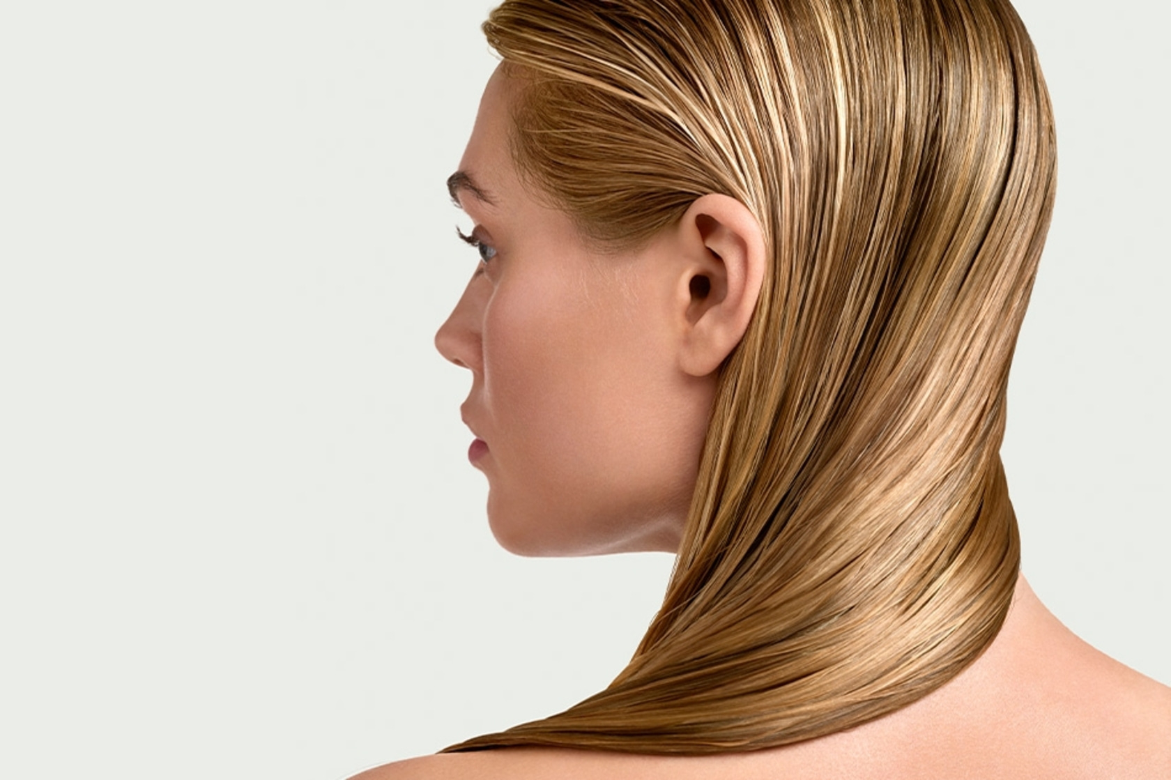 Portrait of a woman with blonde hair falling over her shoulder