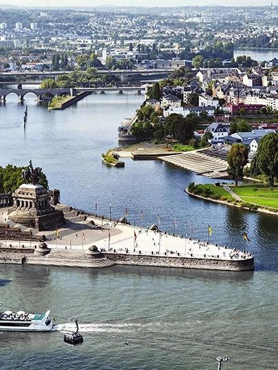 Aerial view of a river city with bridges and monuments