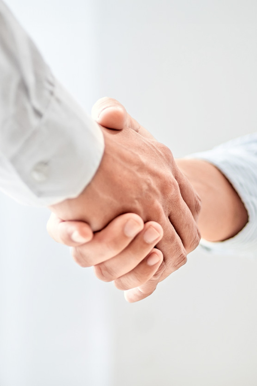 Two hands shaking. Business, partnership, cooperation, agreement, handshake.