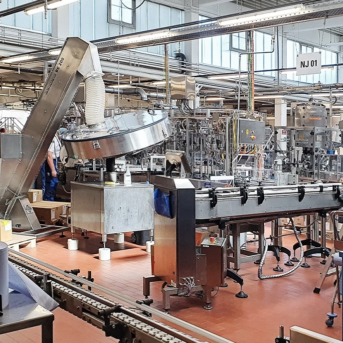 Factory with machinery and conveyor belts. Industrial production in the factory.